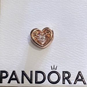 Pandora radiant hearts charm in rose gold pl.